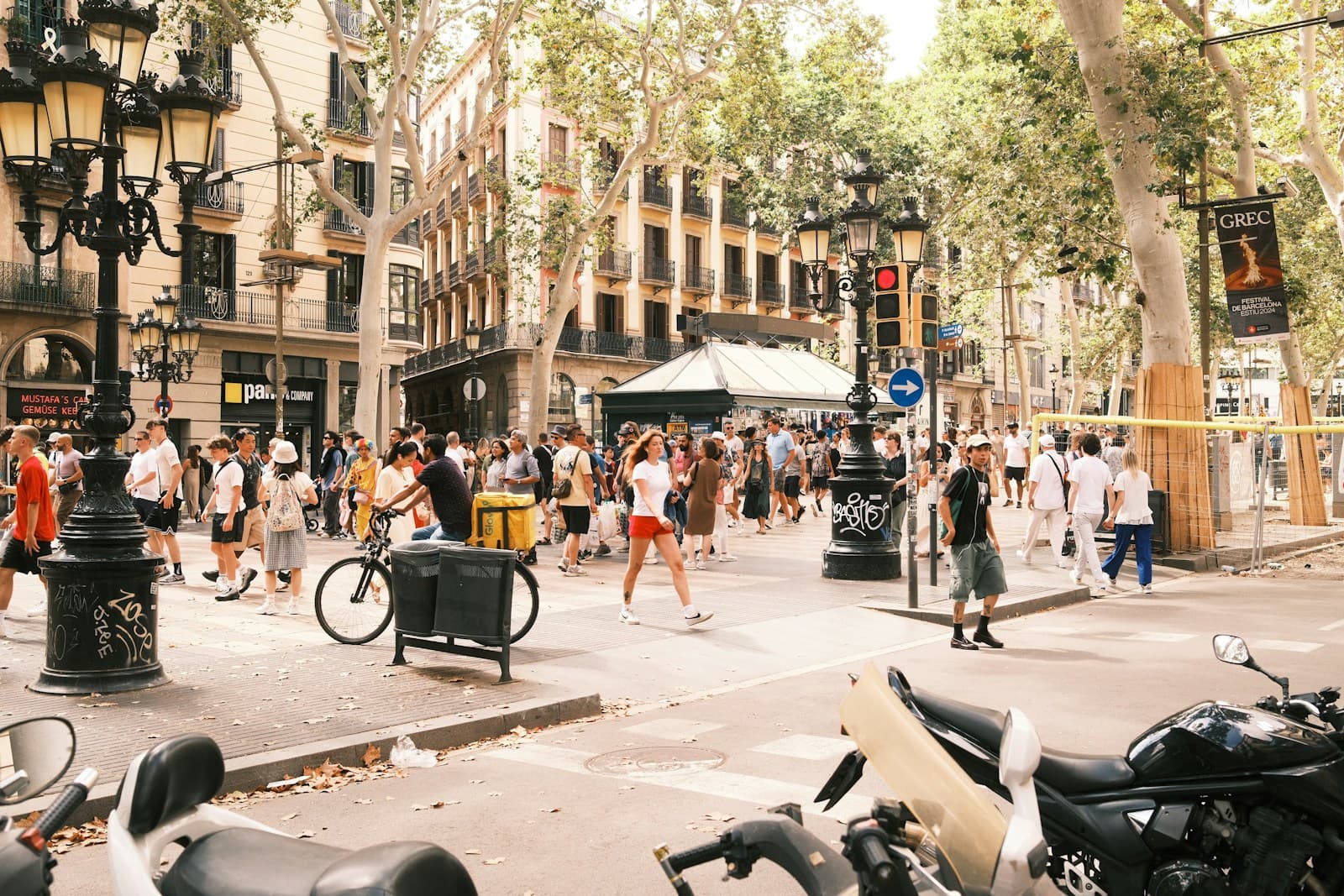 People walking along a lively street in Barcelona, Spain